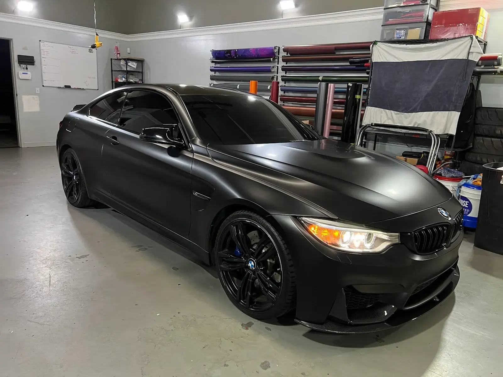 Black BMW inside The Wrap Source workshop