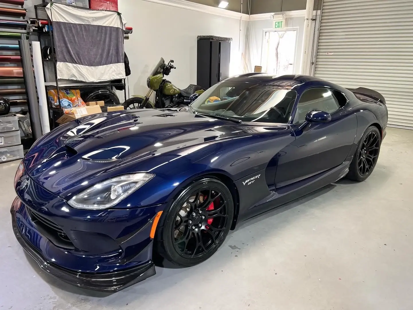 Blue sports car inside the workshop