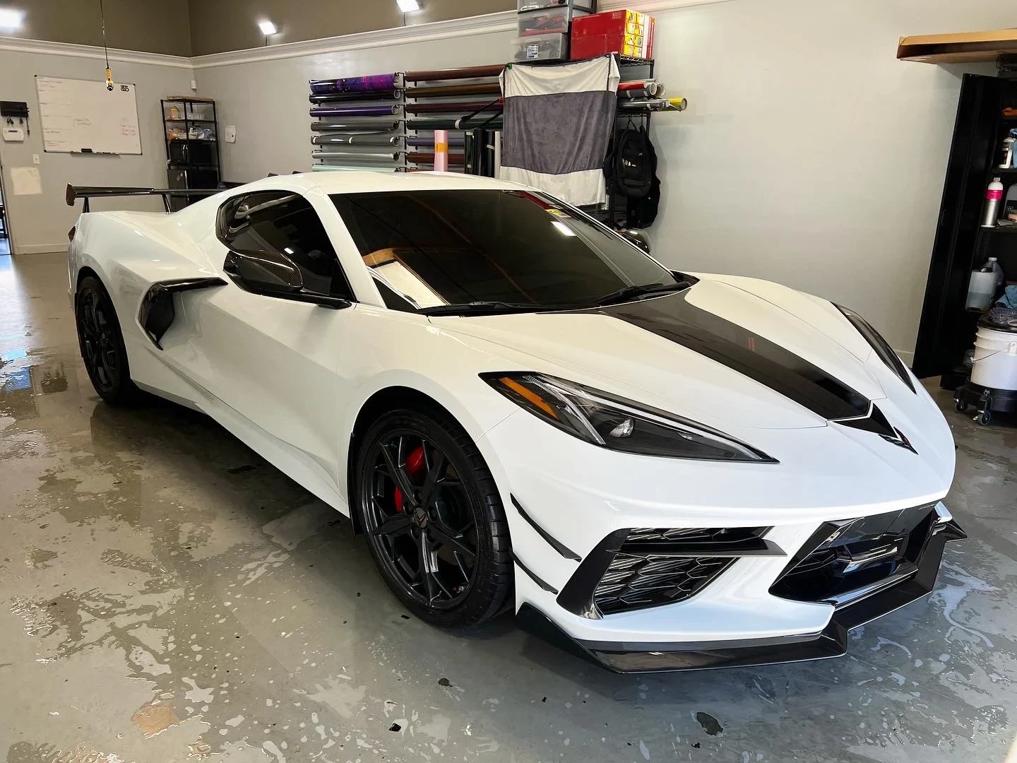 White Chevrolet Corvette inside The Wrap Source