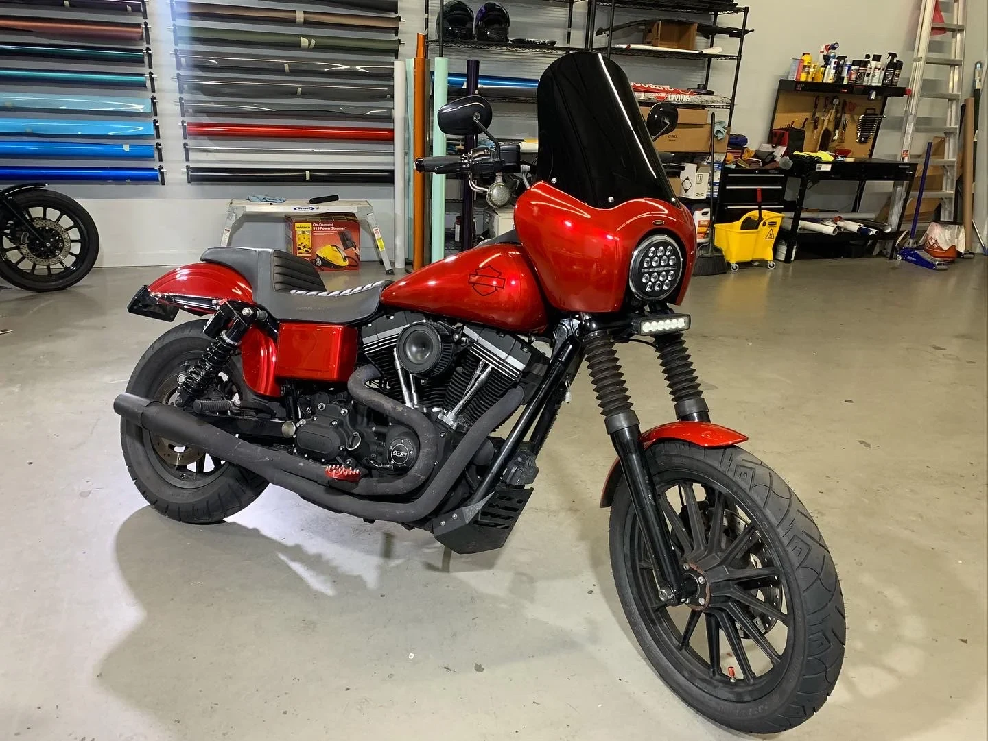 Red touring motorcycle inside the workshop